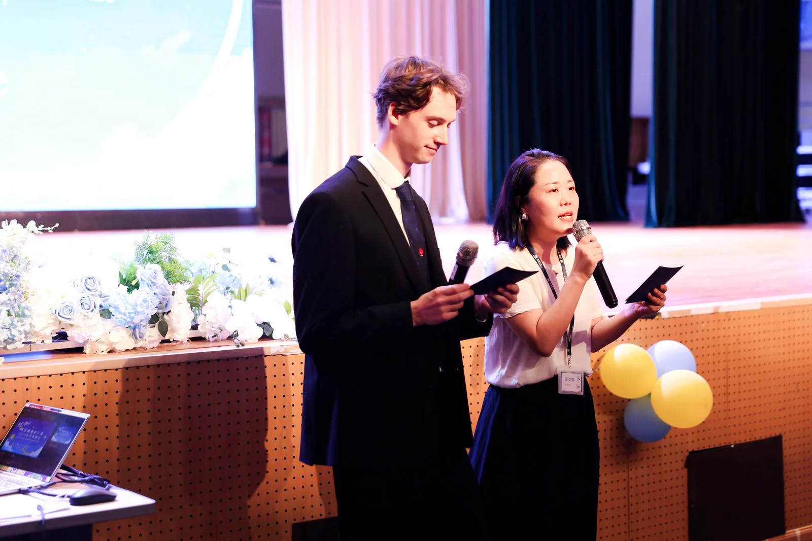 Brinsley Morrison and Renee Zhang presenting the opening ceremony
