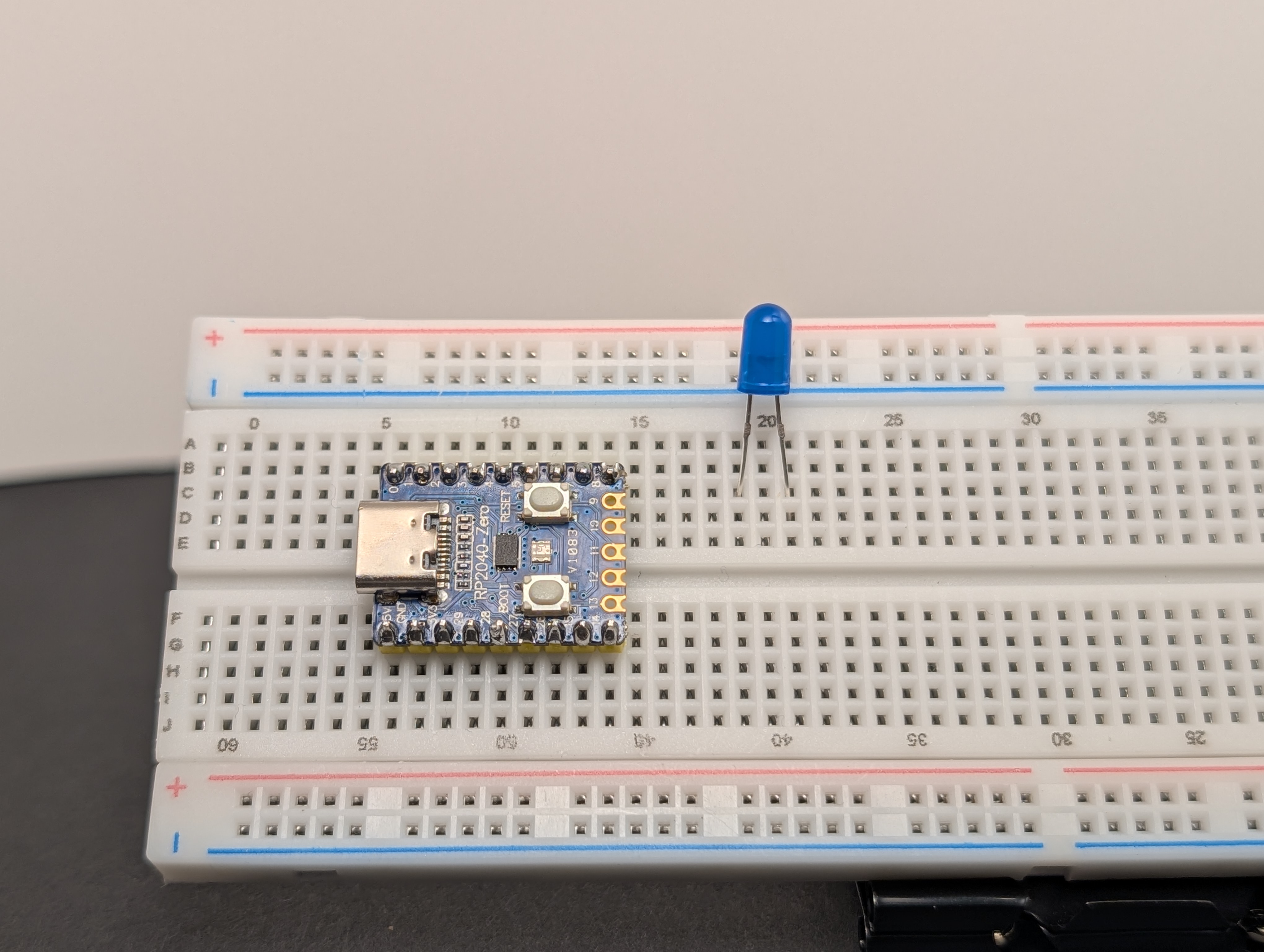Place the LED on the breadboard so the two legs are in different rows.