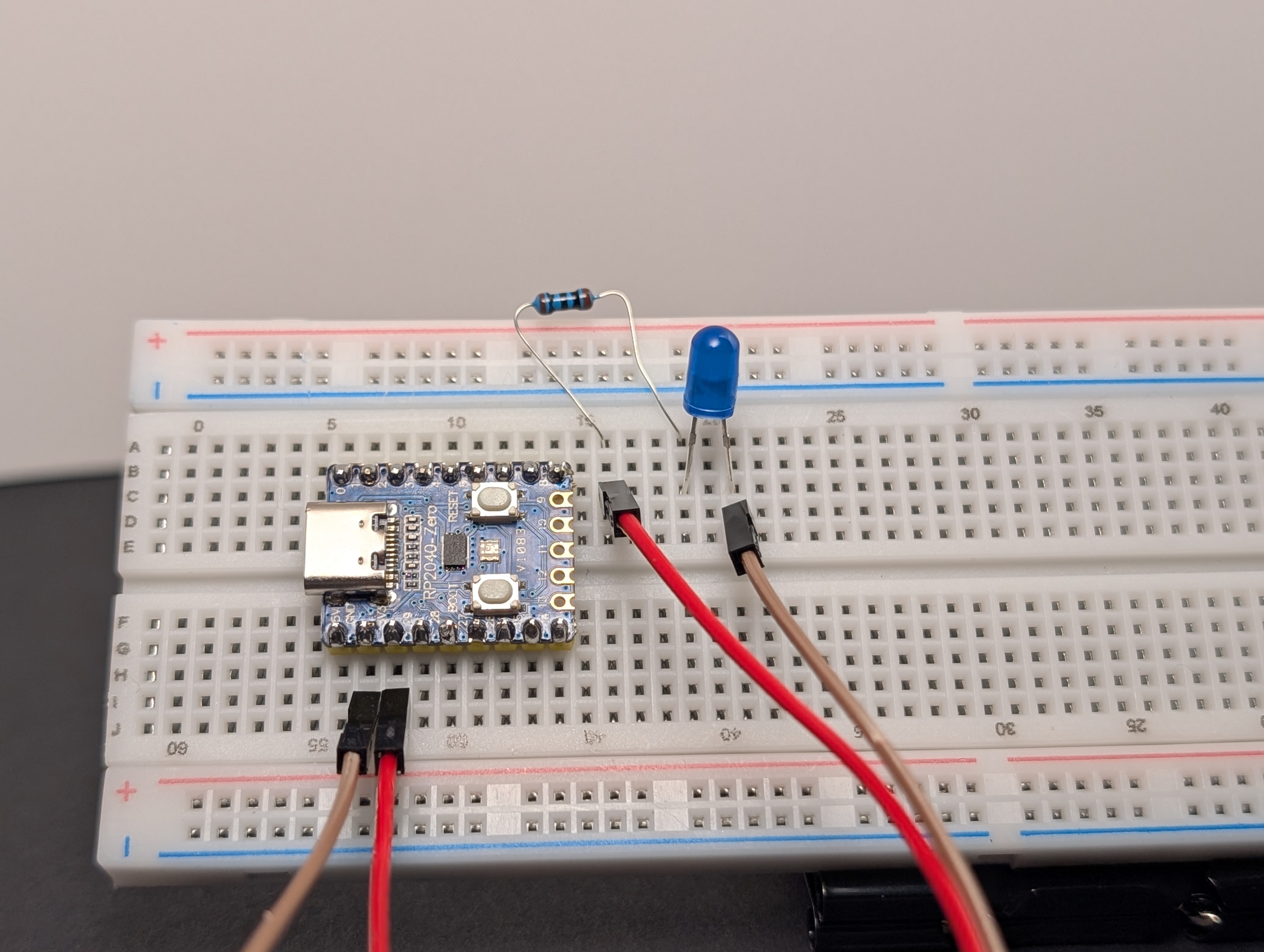 Using a jumper wire, connect the short leg (-) of the LED to GND.
