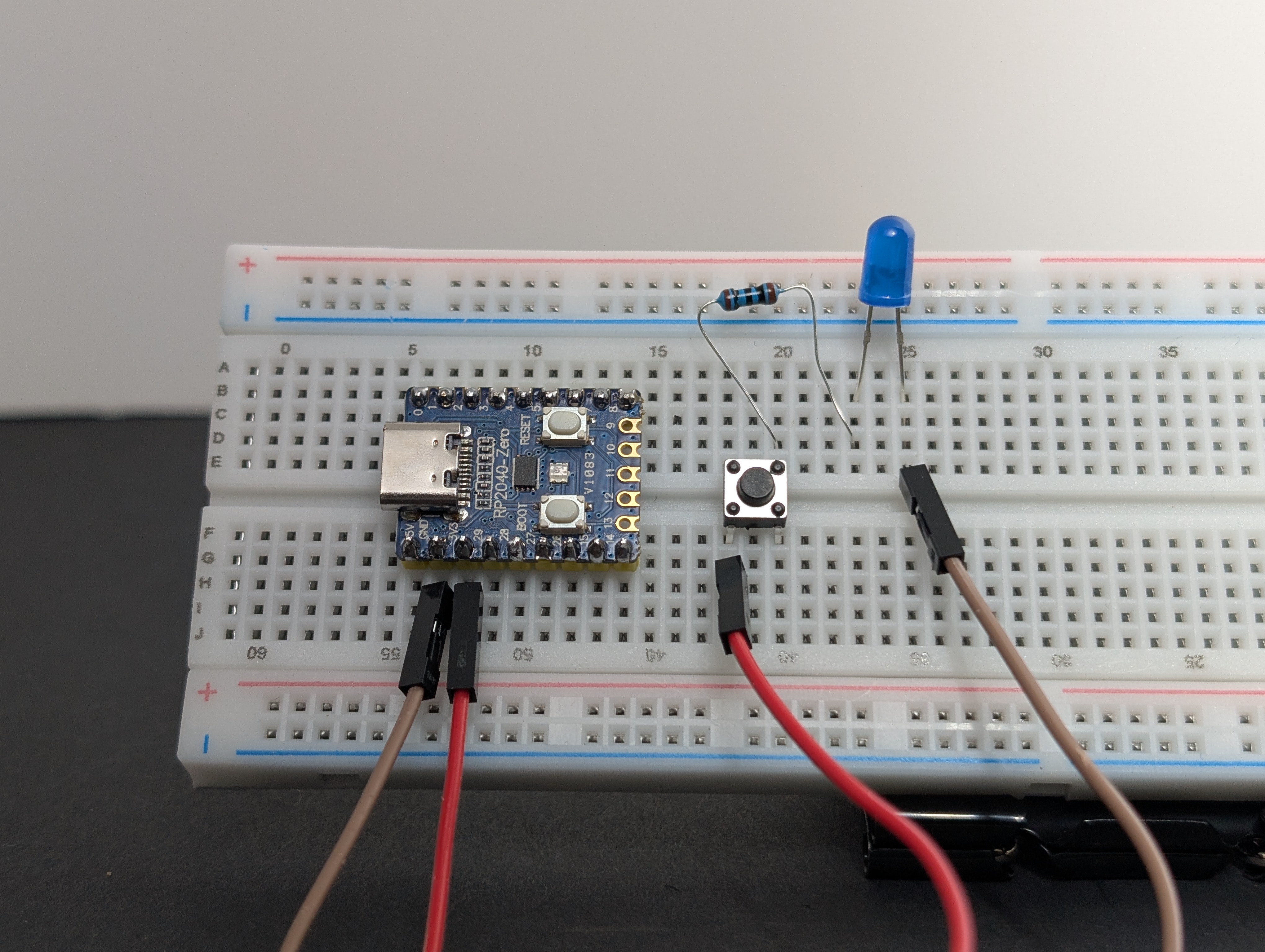Using a jumper wire, connect the short leg (-) of the LED to GND.