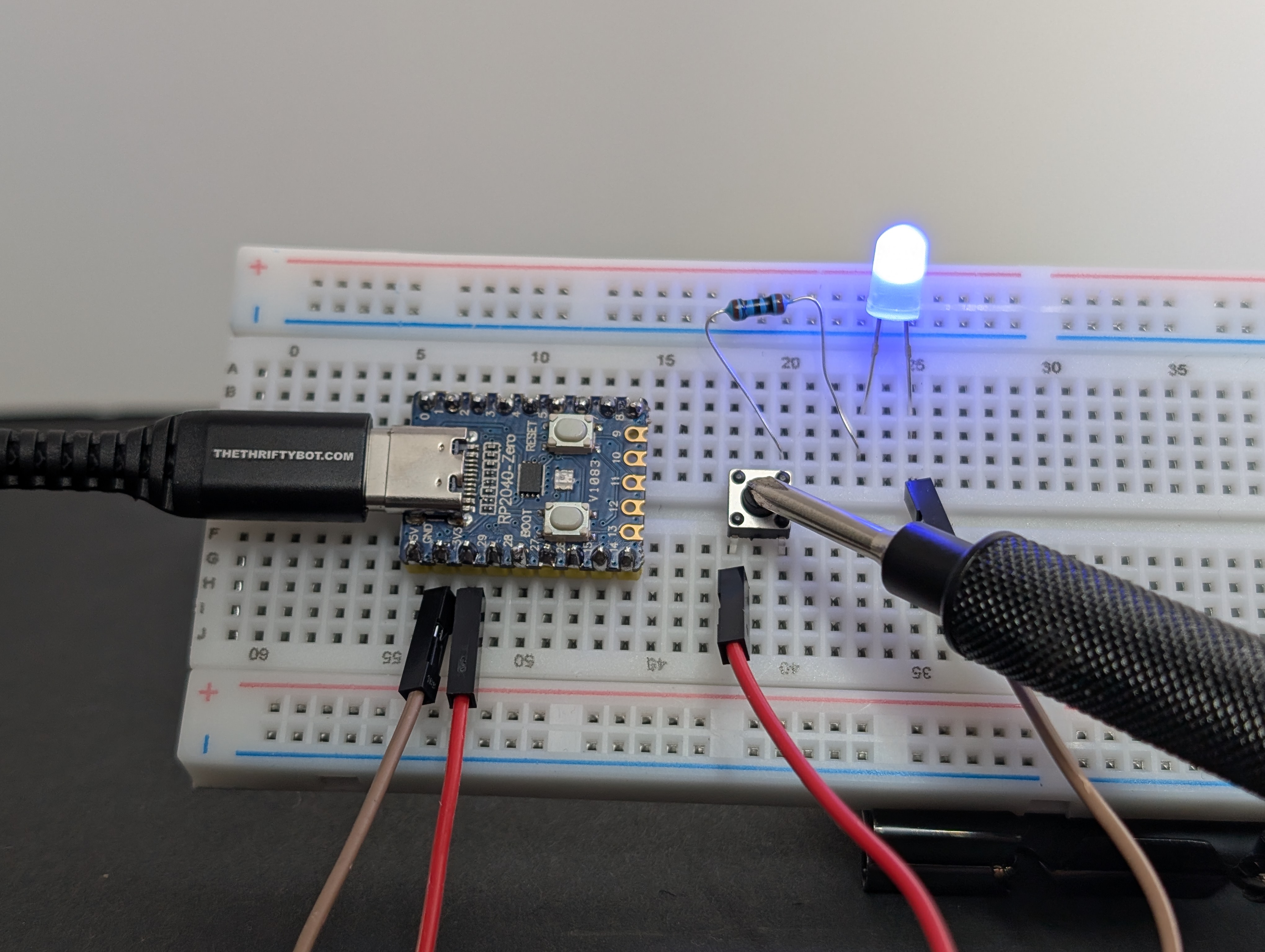 Plug the board into USB, then test the button. (pressed)
