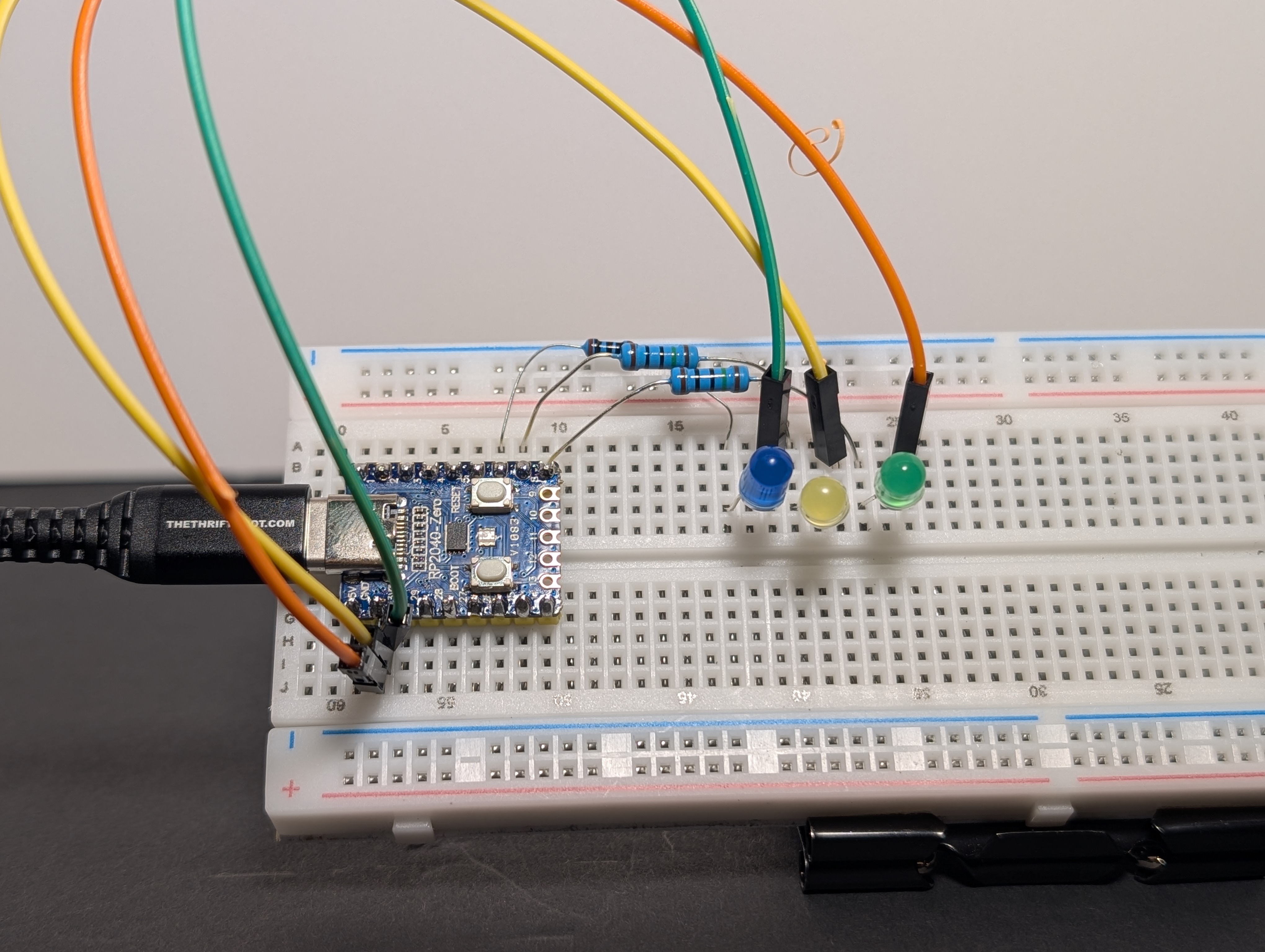 Wiring diagram showing three LEDs connected to GP6 (GPIO 6), GP7 (GPIO 7), and GP8 (GPIO 8) through separate resistors, all returning to GND for a chase animation