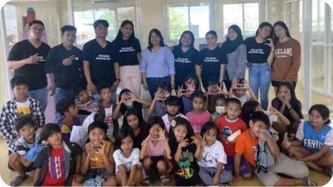 Volunteers and HappY Kids Posing for a Group Photo