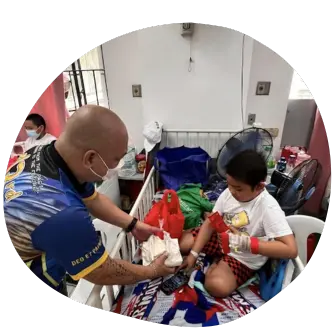 A Man Handing a Kid Food