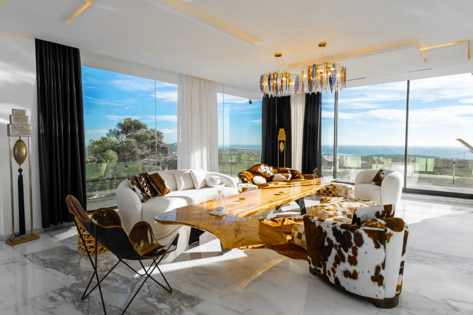 a modern living room with a view of the ocean

