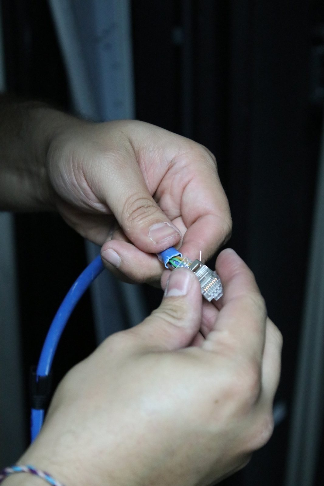 A technician terminating a cable