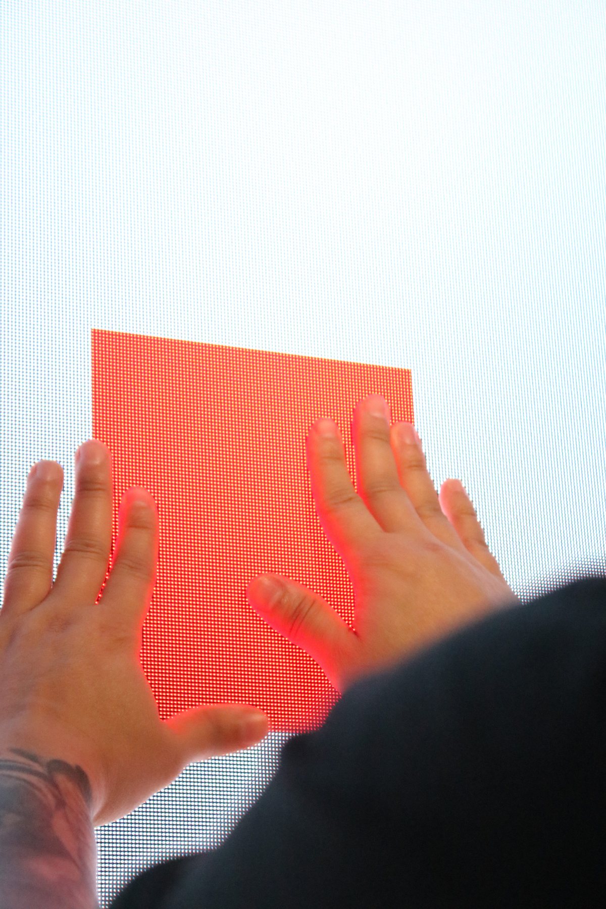 Hands seating a new LED module