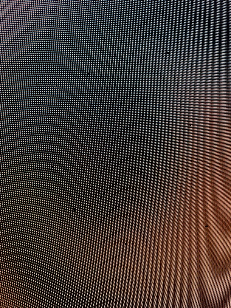 The LED panel before repair, with dead pixels