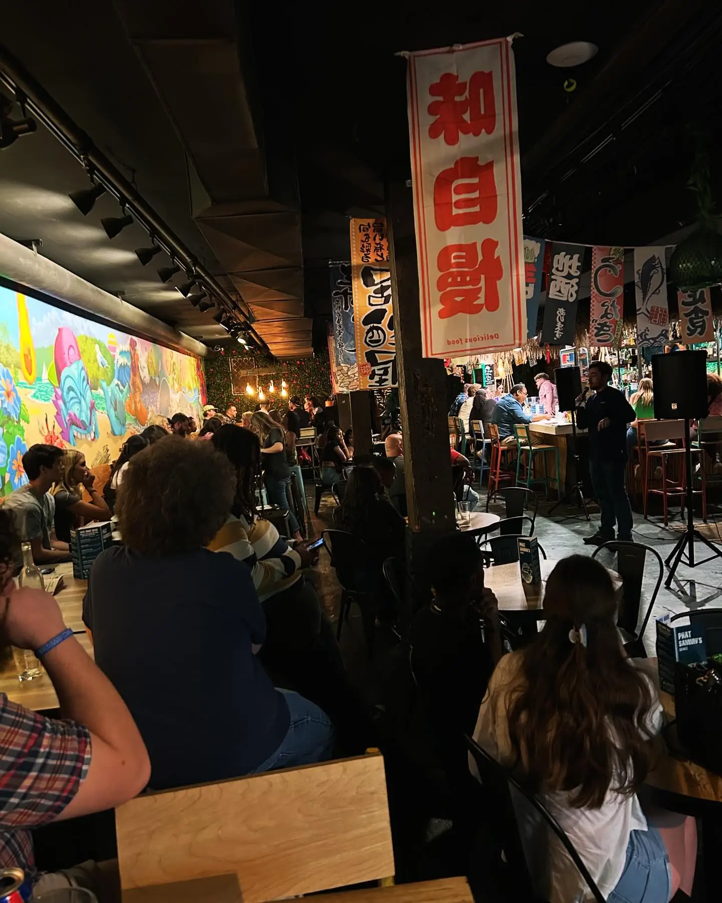 Audience and performer at Phat Sammy's 2