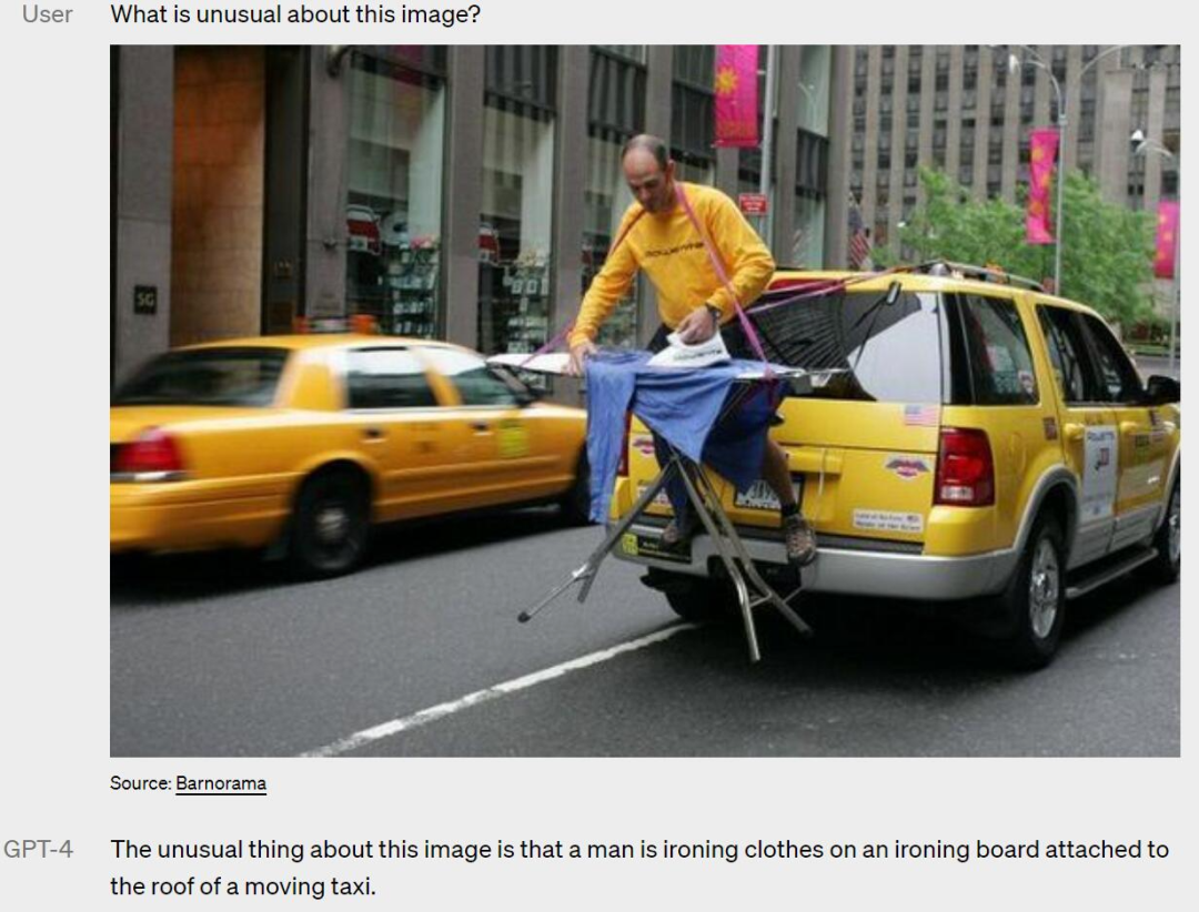 A man is ironing clothes on an ironing board on the roof of a moving cab