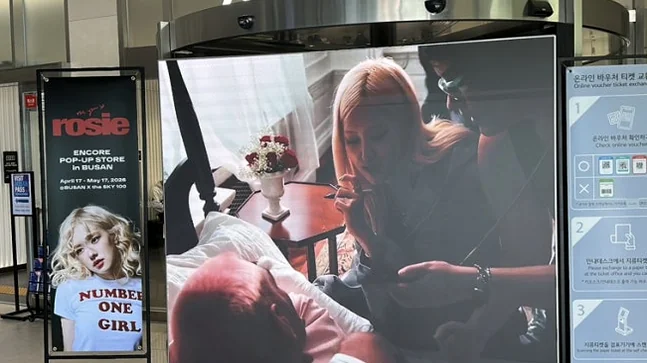 The dazzling entrance to the pop-up store, illuminated with dynamic red multimedia displays that create an exciting and immersive pathway for visitors - ROSÉ ENCORE POP-UP in BUSAN: A Deep Dive into 'one year of rosie' at BUSAN X the SKY