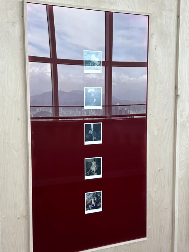 An intimate exhibition area displaying a collection of rare, previously unreleased Polaroid photographs that offer a glimpse into the artist's personal journey - ROSÉ ENCORE POP-UP in BUSAN: A Deep Dive into 'one year of rosie' at BUSAN X the SKY