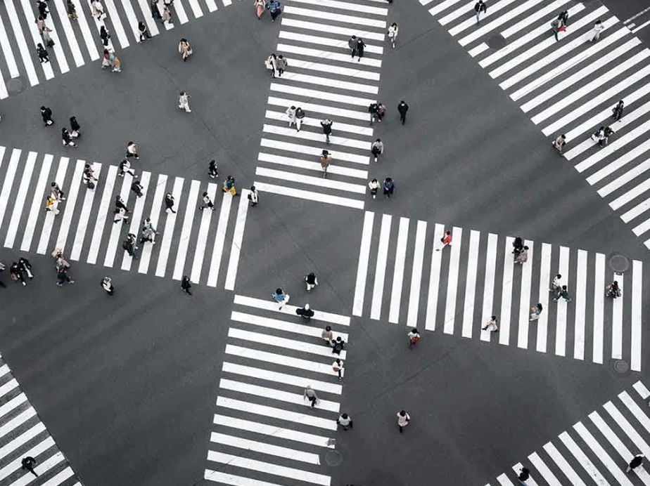 A detailed close-up of a metallic street pole supporting a safety sign, highlighting its industrial texture and surroundings - Navigating the Pause: The Essential 2026 Guide to Korea’s Right-Turn Regulations