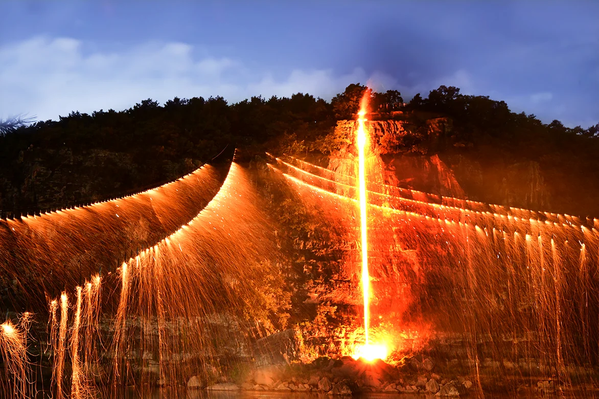 The breathtaking moment when the fire ropes are ignited against the night sky - A Symphony of Falling Stars: The 450-Year-Old Fire Ritual of Andong Hahoe Village