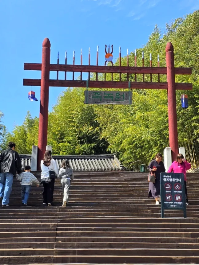 A small, secluded Hanok pavilion nestled among the trees, offering a quiet space for rest and meditation. - The Vertical Elegance of 죽녹원: A 2026 Masterclass in Bamboo Minimalist Living