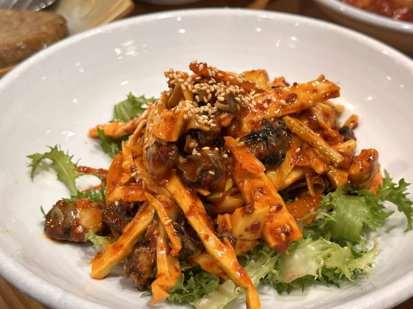 A seasoned snail salad (Golbaengi-muchim) served as a side dish at a traditional Korean restaurant in Damyang. - The Vertical Elegance of 죽녹원: A 2026 Masterclass in Bamboo Minimalist Living