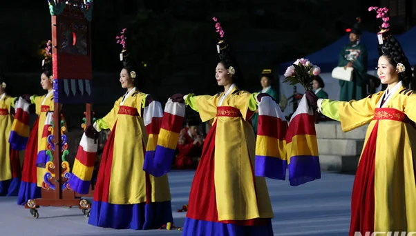 A panoramic view of Munjeongjeon Hall prepared for the night banquet with golden lighting - Royal Filial Piety Reimagined: The 2026 Changgyeonggung Yayeon Night Banquet