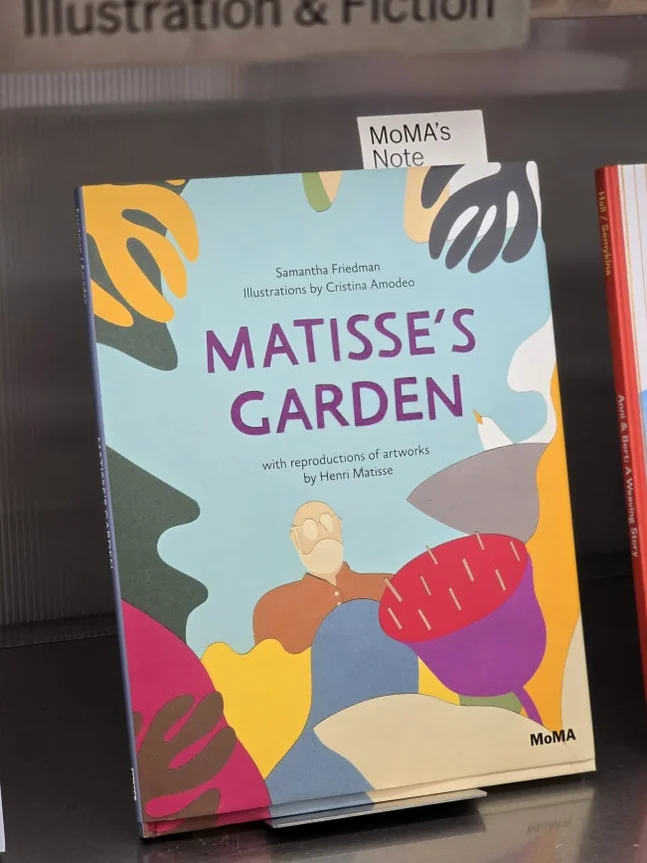 The beautifully illustrated cover of 'Matisse's Garden' prominently displayed on a shelf, reflecting the bookstore's selection of enriching art books that celebrate iconic artists and their enduring legacies. - MoMA Bookstore Seoul: A Curated Sanctuary for Art and Design