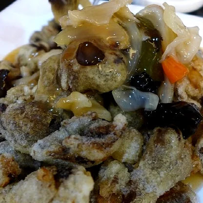 An expertly plated serving of Tangsuyuk, the golden-fried pork providing a crunchy counterpoint to the soft noodles of the main course. - Jeju Heritage Gastronomy: The Timeless Allure of Deokseongwon Seogwipo