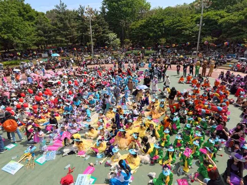 The AI-integrated magic show captivating a large audience in the open-air theater - Narrative Arc at Banghwa Neighborhood Park: The 2026 Gangseo Fairy Tale Festival