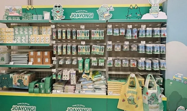 A bustling display of Joayong merchandise, featuring an array of adorable plush toys and various character-themed goods, showcasing the breadth of collectible items available at the pop-up. - Joayong's Popcorn Journey: E-Mart Borajum's Premier Character Pop-Up