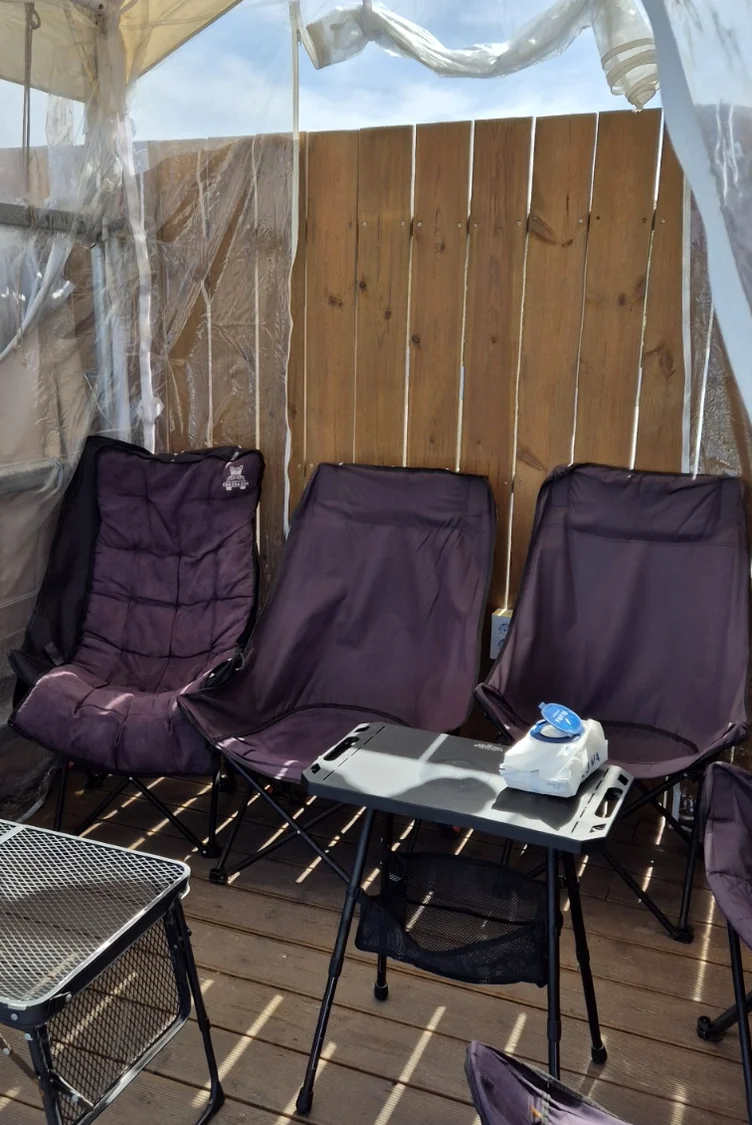 The expansive rooftop terrace of Dokkebi Gelato, featuring a series of cozy, semi-private tented cabanas and comfortable seating, offers an idyllic setting with breathtaking views of the ocean. - Jumunjin's Dokkaebi Gelato: A Curated Coastal Escape Beyond the Screen