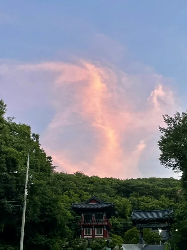 alt="The golden hour descends upon the temple entrance, wrapping the sacred grounds in a warm, ethereal glow that marks the end of a meditative day." - Golgulsa Temple: Ascetic Luxury in Gyeongju’s Sacred Limestone Grottoes