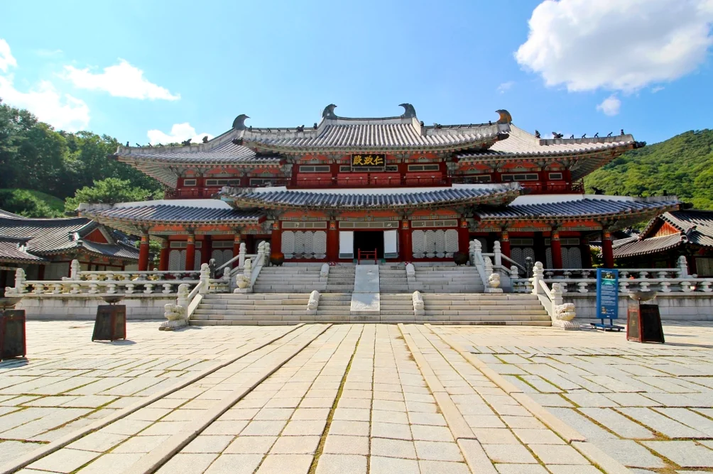 Intricate wooden details and traditional Dancheong patterns on a palace entrance gate - Cinematic Grandeur: Architectural Time Travel at Yongin Daejanggeum Park