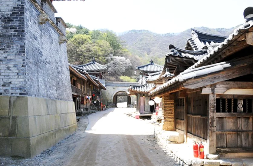 A dramatic scene from the drama 21st Century Grand Princess filmed at the main palace - Cinematic Grandeur: Architectural Time Travel at Yongin Daejanggeum Park