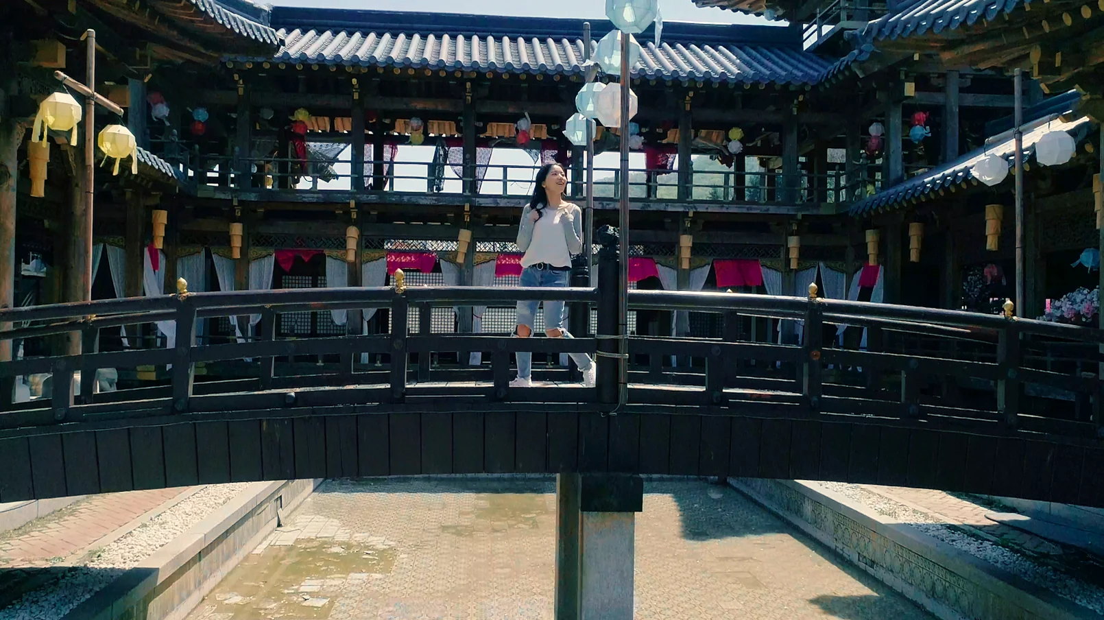 Modern white caravans parked on a hill overlooking the historical set buildings - Cinematic Grandeur: Architectural Time Travel at Yongin Daejanggeum Park