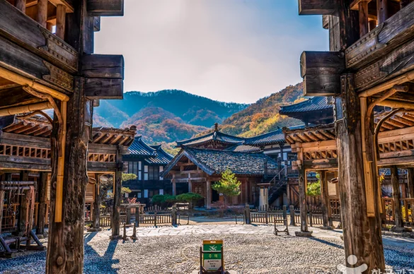 A cozy barbecue setup outside a caravan during a sunset over the valley - Cinematic Grandeur: Architectural Time Travel at Yongin Daejanggeum Park