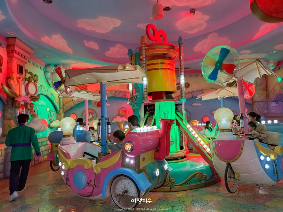 A charming wooden-themed play area designed for young children, featuring unique interactive elements and a whimsical tree-like structure in the background. - Lotte World Jamsil: The Ultimate Multi-Layered Fantasy Realm in Seoul