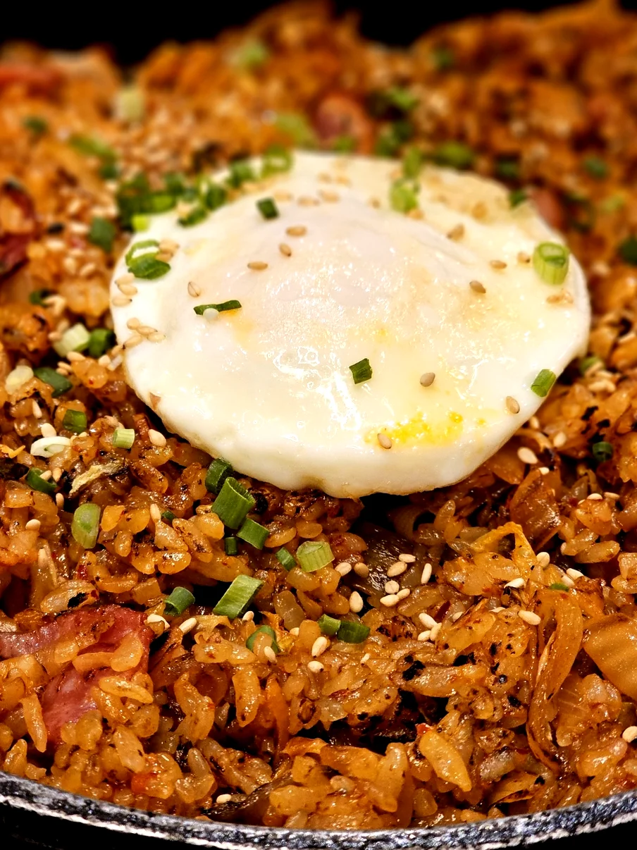 Long strings of melted cheese stretching from a pizza slice - Gastronomic Icon: The Definitive Guide to Lee Jae-mo Pizza Main Store