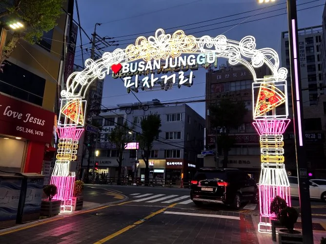 Close up of the golden brown stuffed pizza crust - Gastronomic Icon: The Definitive Guide to Lee Jae-mo Pizza Main Store
