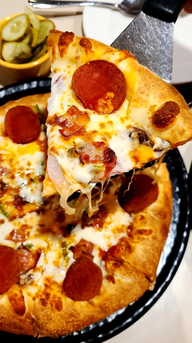 Modern restaurant interior with spacious wooden tables and high ceilings - Gastronomic Icon: The Definitive Guide to Lee Jae-mo Pizza Main Store