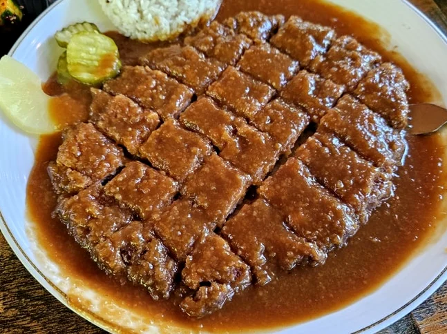 Breaded pork cutlet saturated with a rich and savory sauce. - The Culinary Hermitage of Suncheon: A Refined Guide to Songchi Maeul