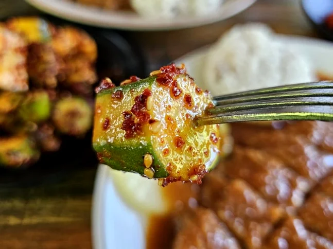 A piece of seasoned cucumber showing its succulent texture. - The Culinary Hermitage of Suncheon: A Refined Guide to Songchi Maeul