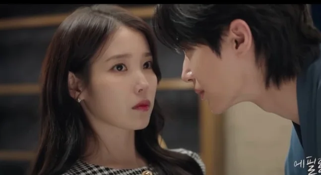 The male and female leads, IU and Byun Woo-seok, in a tense face-off, conveying raw emotional intensity. - 21st Century Grand Prince's Lady: A Royal Romance Redefined (K-Drama Review)