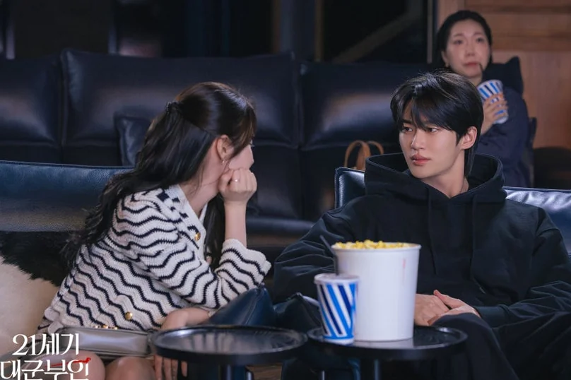 A luxurious private cinema setting where the protagonists enjoy a date, aligning with a high-end magazine's aesthetic. - 21st Century Grand Prince's Lady: A Royal Romance Redefined (K-Drama Review)