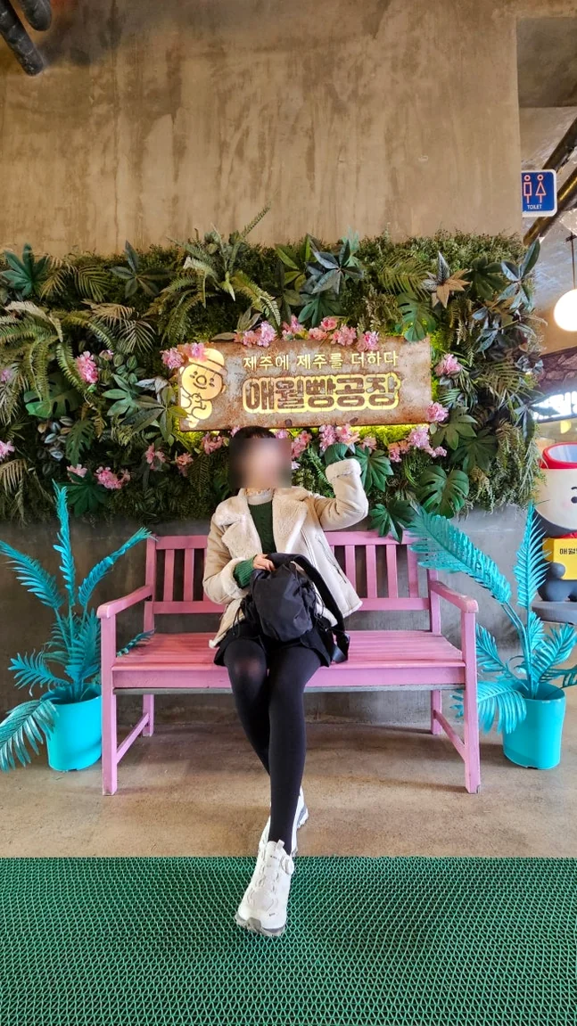 Indoor photo spot featuring a bright pink bench and lush plant decorations - Coastal Crust and Artisanal Calm: The Definitive Guide to Aewol Bread Factory Jeju