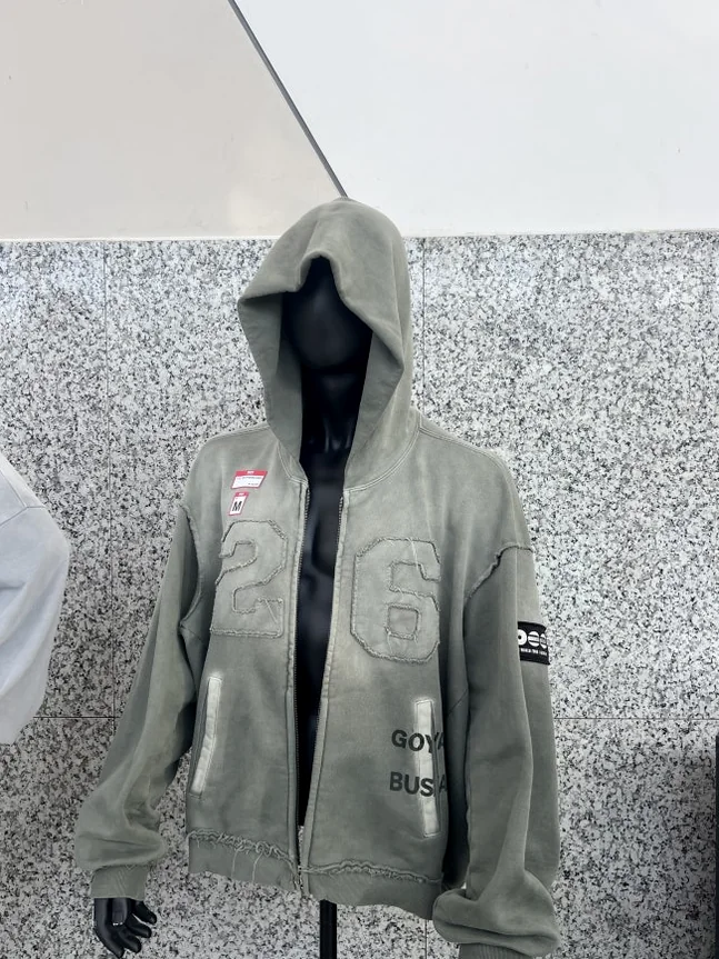 Display of the official grey tour hoodie on a mannequin at the KINTEX merch hall - BTS Arirang World Tour: A Masterpiece of Cultural Heritage and Global Modernity