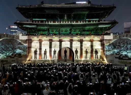 The outdoor stage illuminated with vibrant lights during a traditional-themed performance - BTS Arirang World Tour: A Masterpiece of Cultural Heritage and Global Modernity