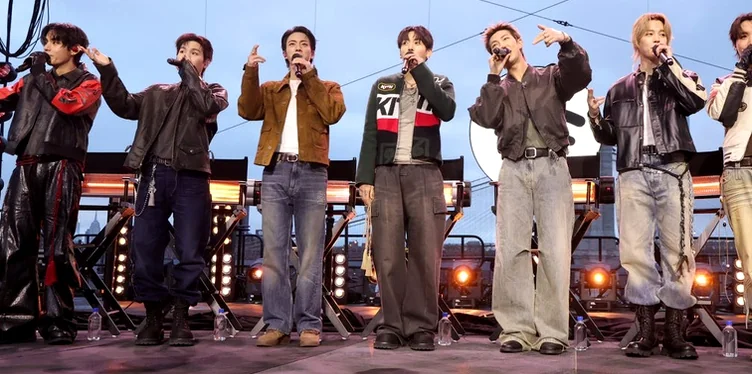 BTS members in casual tour outfits waving to fans from the stage - BTS Arirang World Tour: A Masterpiece of Cultural Heritage and Global Modernity