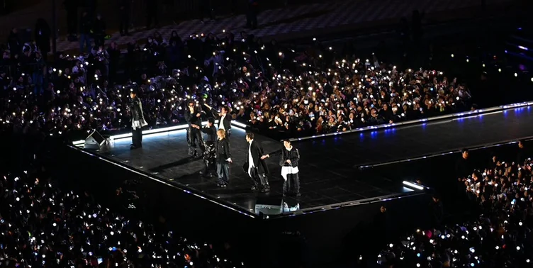 The breathtaking view of a stadium filled with thousands of glowing fan lights during the performance - BTS Arirang World Tour: A Masterpiece of Cultural Heritage and Global Modernity