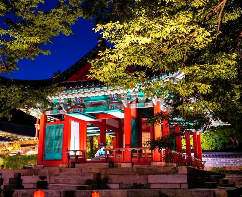 Injeongjeon Hall glowing in golden night lights