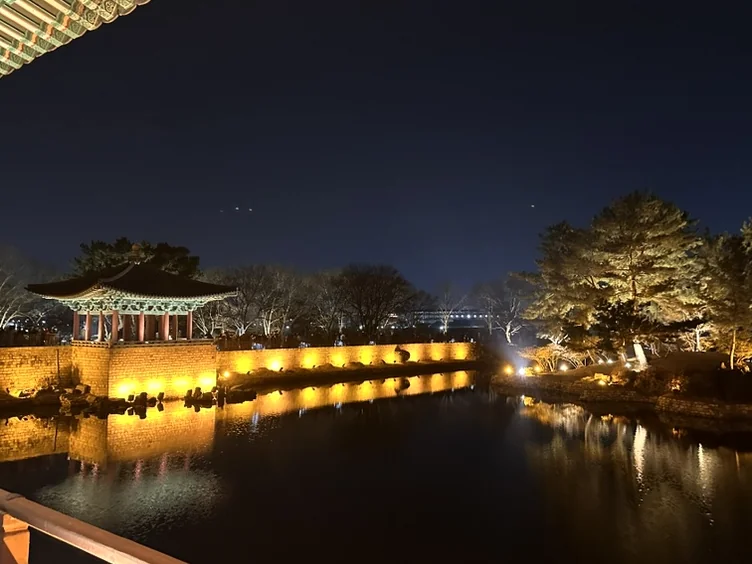 The spectacular golden night view of the main palace pavilion reflected brilliantly on the surface of Wolji Pond - Beyond the Moonlight: The Timeless Allure of Gyeongju Donggung Palace and Wolji Pond