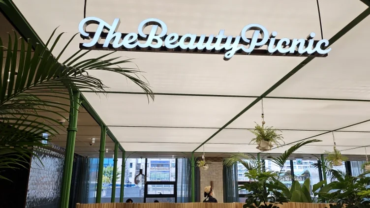 An interior sculpture symbolizing 'The Beauty Picnic' concept amidst fresh plant decor. - Olive Young N Seongsu Lounge: An Exclusive K-Beauty & Lifestyle Sanctuary in Seoul's Trendsetting District
