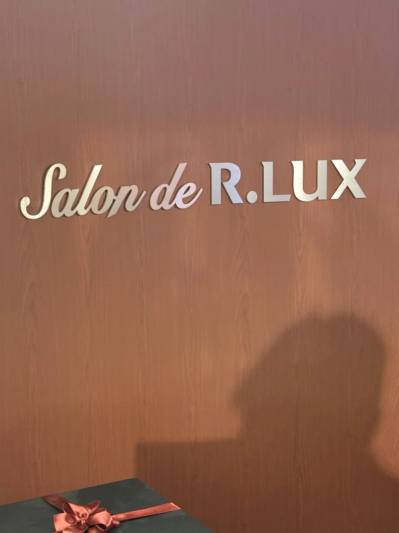 The stylish entrance branding featuring a sharp contrast of black awnings and white doors - Inside Salon de R.LUX: The Pinnacle of Seongsu-dong's Luxury Lifestyle Pop-up