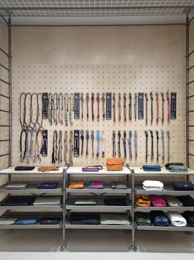 Full display of Topologie straps and small accessories organized on minimalist metal shelves - ソウルの森に誕生した Topologie 韓国初フラッグシップ：2026 SS ‘The Starbound’ の世界 🧭