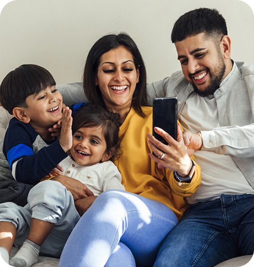A happy family — parents and children smiling together
